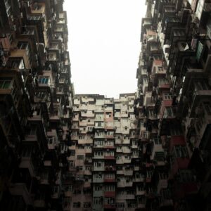 A tall dystopian apartment building in Hong Kong