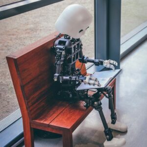 Robot on a bench reading a book